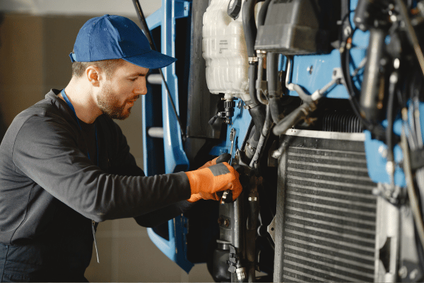 Technician repairing pump equipment at Tesco Equipment & Supply Co in Abilene TX