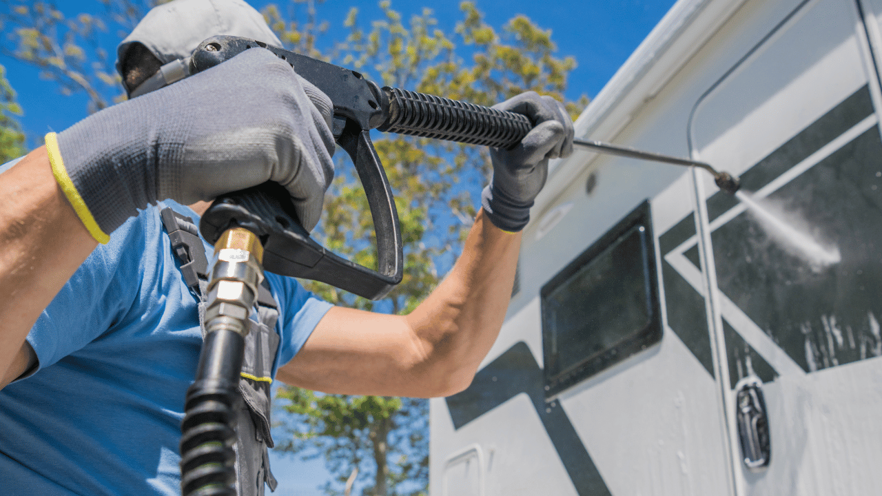 Technician using a pressure washer during pressure washer repair service in Abilene TX