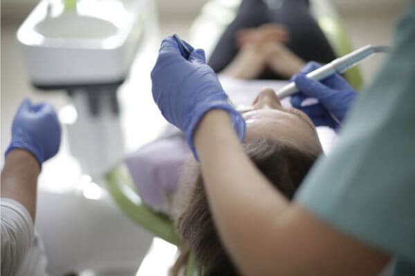 Dental office equipment using air compressor and dental vac systems during patient care